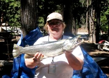 An angler holding a fish.