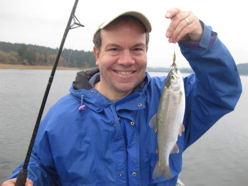 An angler holding a fish.