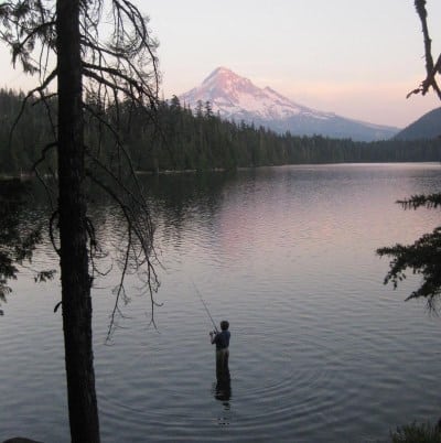 An angler bank fishing at lost lake near mount hood.