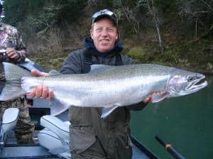 An angler holding a large fish.