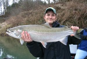 An angler holding a fish.