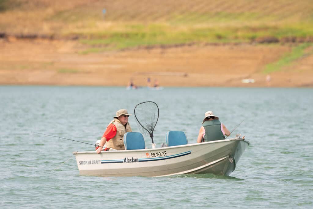 Two anglers boat trolling at Hagg Lake.