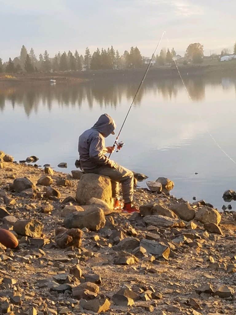 An angler bank fishing for trout at pine hollow.