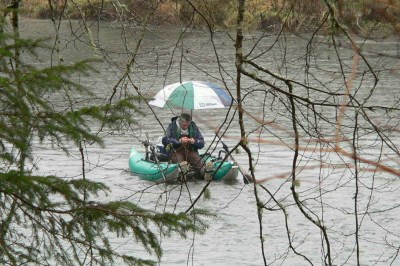 Two anglers on a boat on kilchis river.