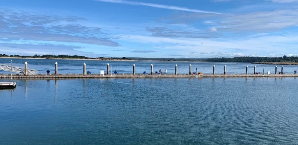 A long dock in Bandon is lined with recreational crabbers.