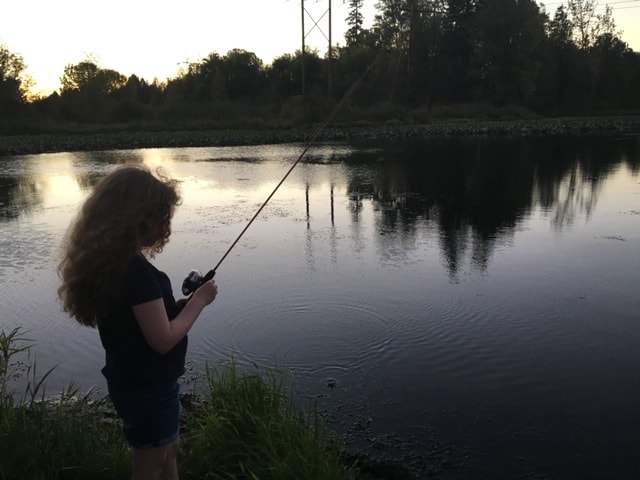 An angler fishing at the bay at bethany lake.