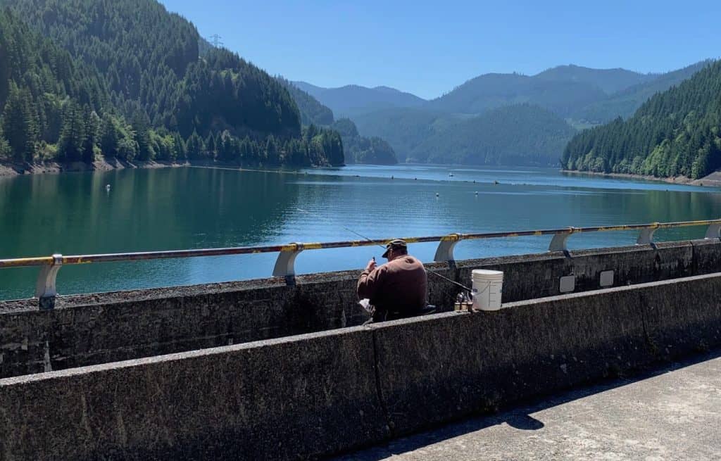 An angler is fishing at detroit lake.