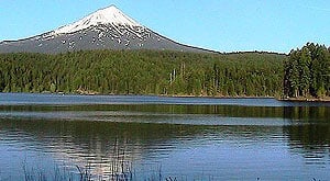 A scenic view of willow lake with a mountain in the background.