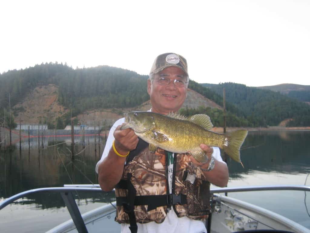 An angler holds a nice bass caught at Galesville Reservoir.