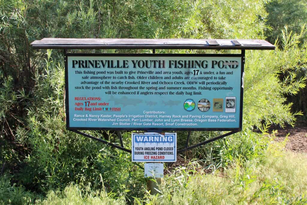 A sign for prineville youth fishing pond.