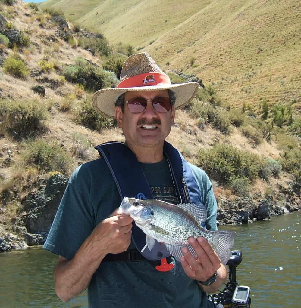 A crappie held by an angler at Brownlee Reservoir on the Oregon Idaho border.