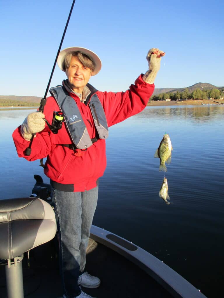 An angler holding a crappie caught at prineville reservoir.