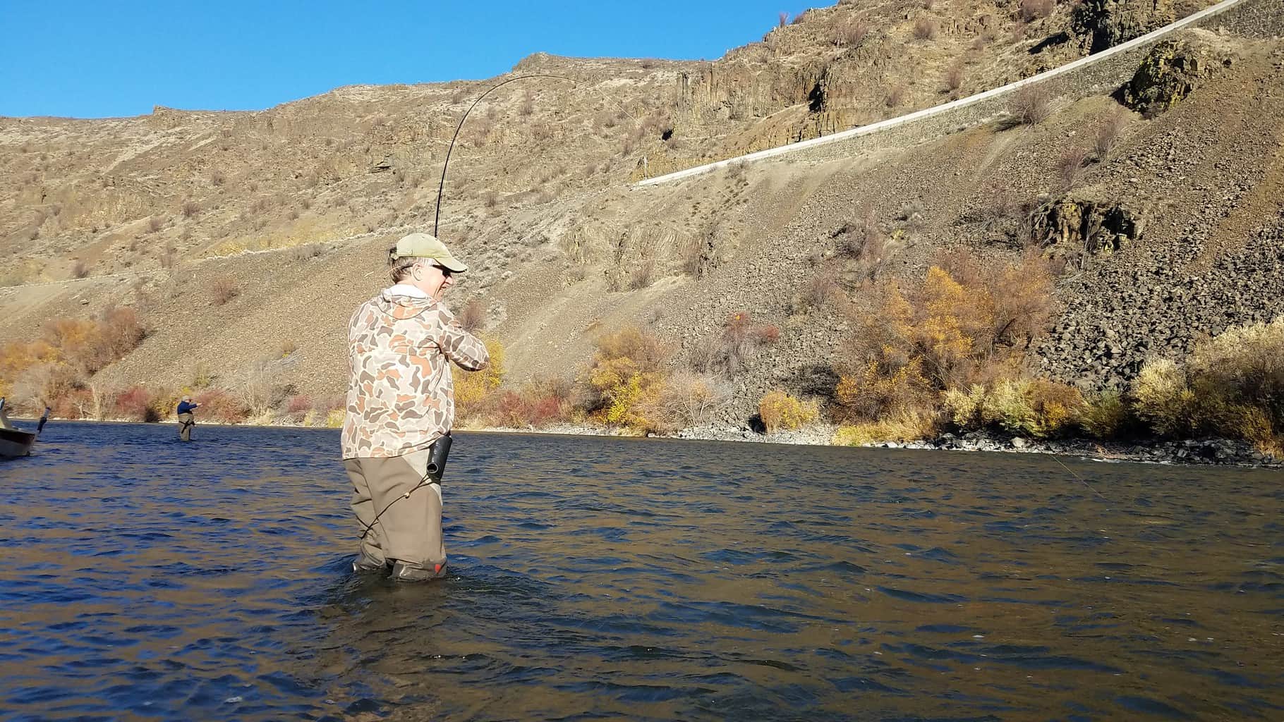 An angler fly fishing at yakima river washington.