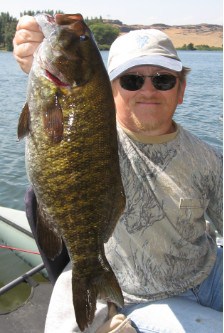 Horsethief Lake smallmouth bass being held by an angler.