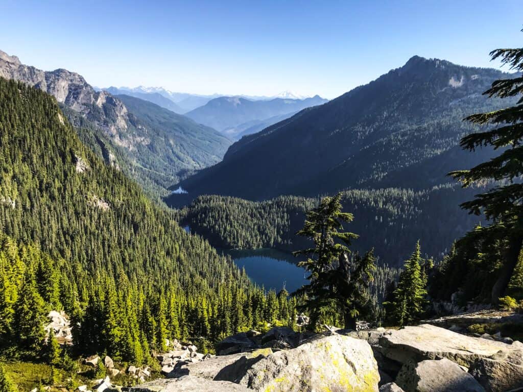 A scenic view of alpine lakes and mountain in the background.