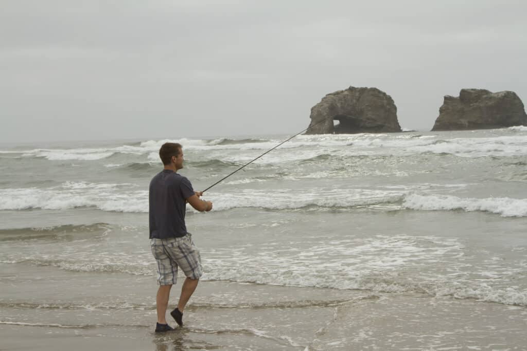 An angler fishing in the surf at Rockaway Beach in Tillamook County.