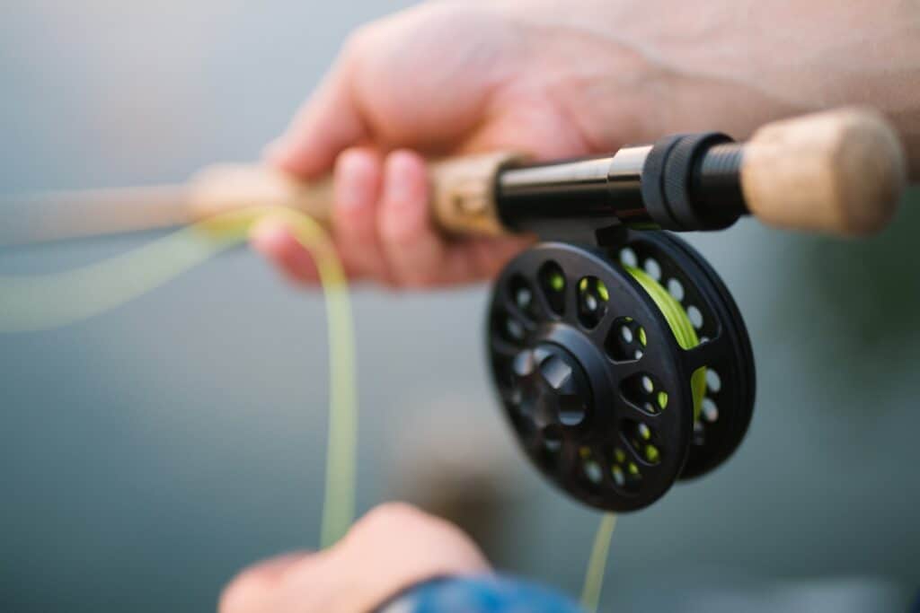 Fly fishing rod and reel closeup.