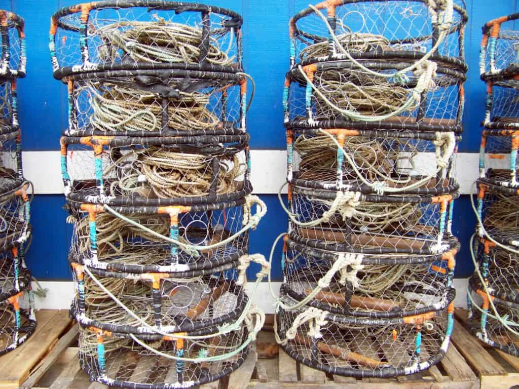 Crab pots are stacked at the docks of Yaquina Bay in Newport, Oregon.