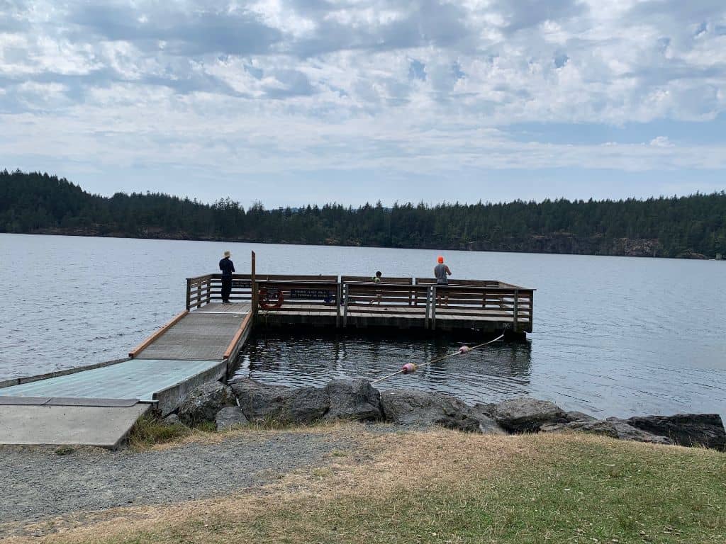 Anglers fishing from the dock at Cascade Lake in Moran State Park.