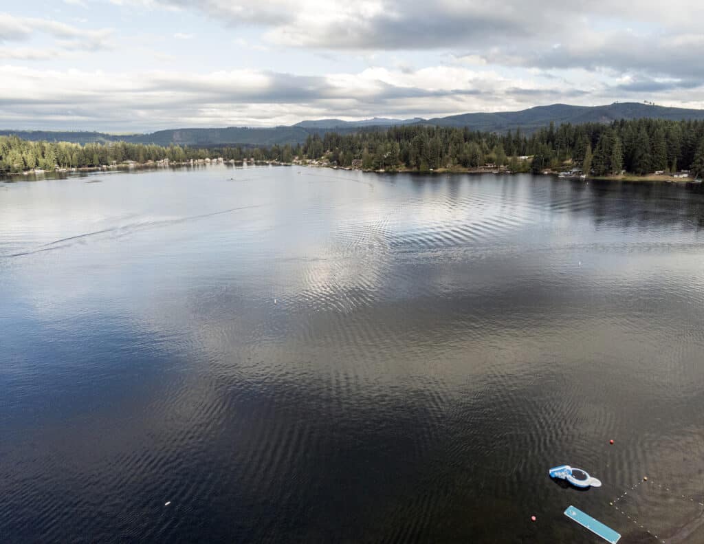 An aerial photo of clear lake pierce county boats in foreground.