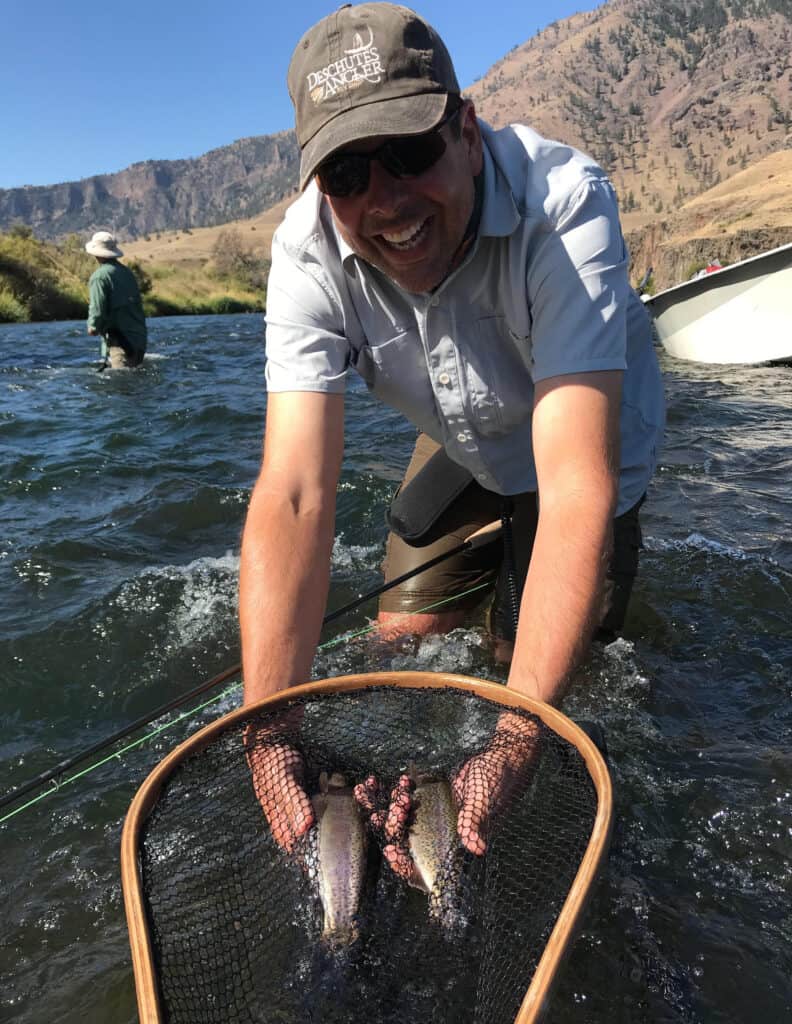 Two trout in a net ready for release back into the deschutes river.