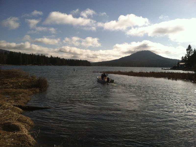 A boat on loon lake in low light.