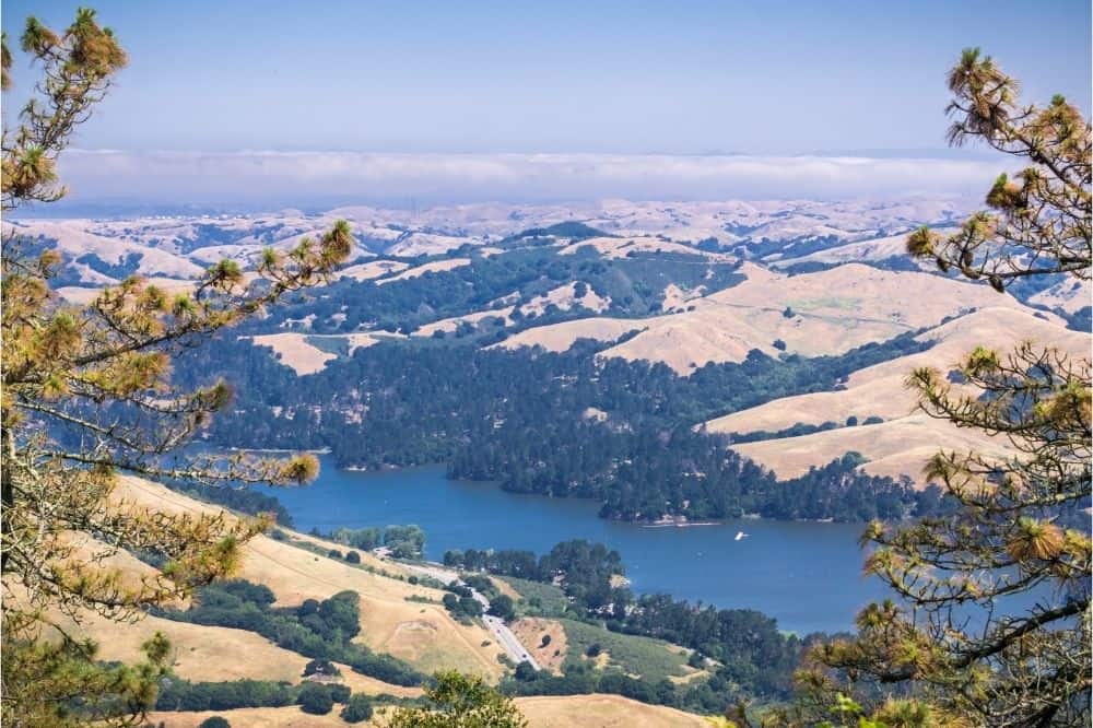 Scenic photo of San Pablo Reservoir and surrounding hills in a popular fishing area in the Bay Area.