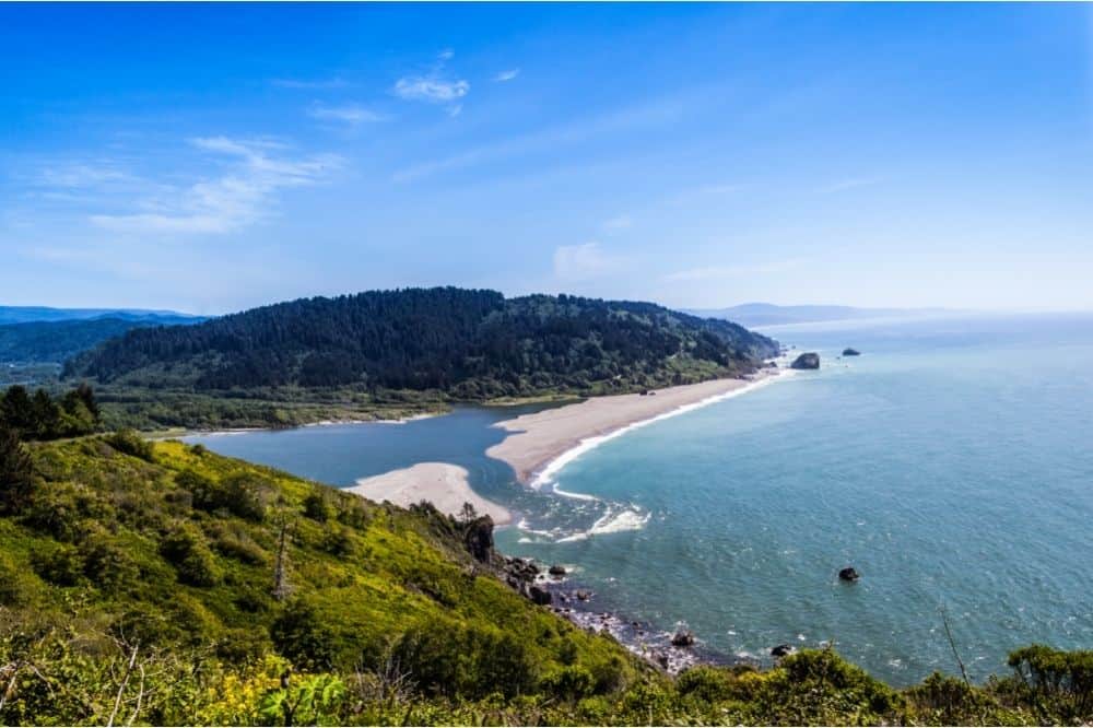 The Klamath River mouth at the Pacific Ocean from a nearby overlook. Tens of thousands of salmon and steelhead pass through this area every year to the delight of anglers.
