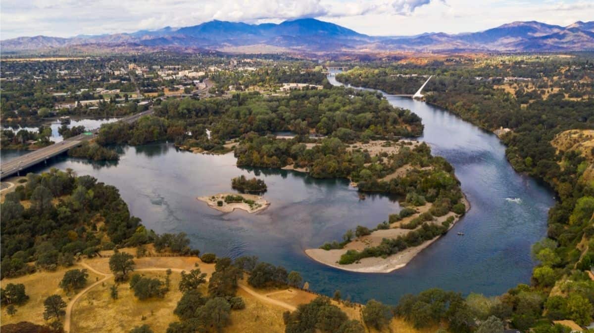 Aerial view of a bend in the Sacramento River through Redding, California