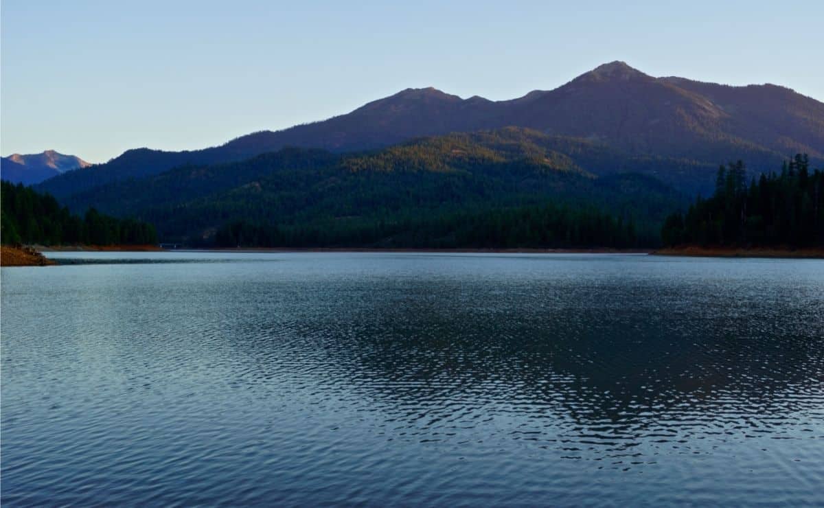 Scenic Trinity Lake in low light with mountains as a backdrop.