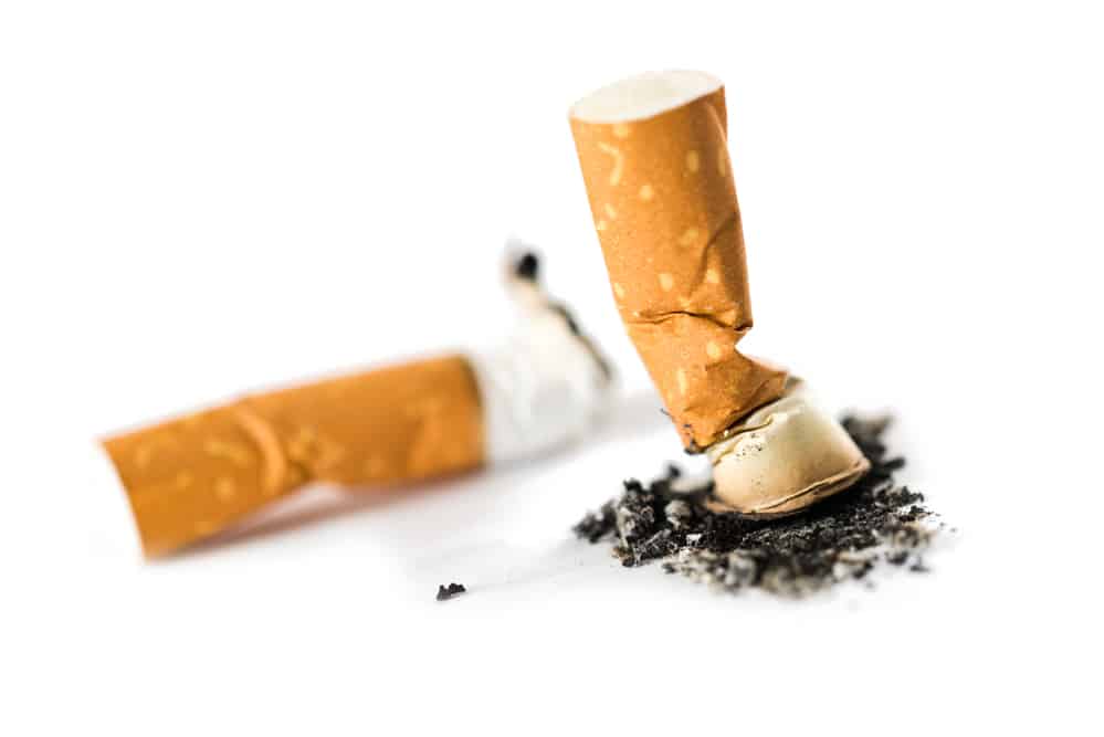 Two cigarette butts isolated on white.