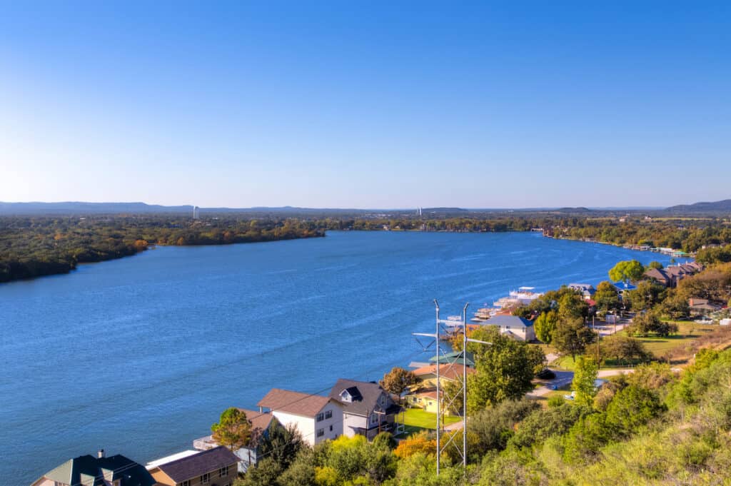 Houses and docks line the shoreline of Lake Lyndon B. Johnson, one of the best bass fishing lakes near Austin, Texas.