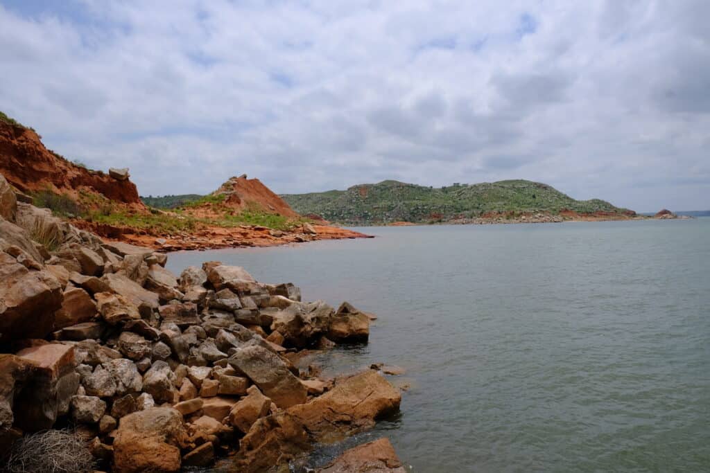 Scenic photo of the rocky shoreline of Lake Meredith, the best bass and walleye fishing lake in the Texas Panhandle.