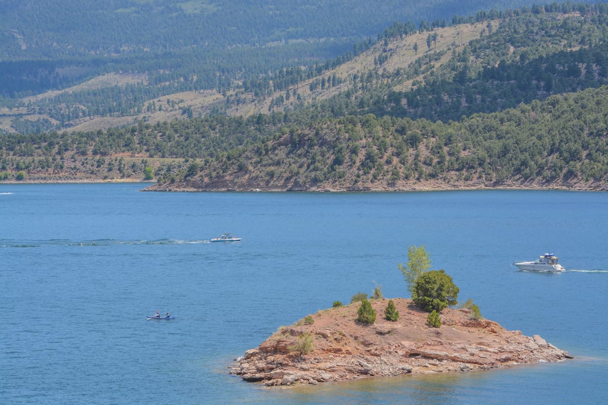Fishing boats on the blue waters of Flaming Gorge Reservoir.