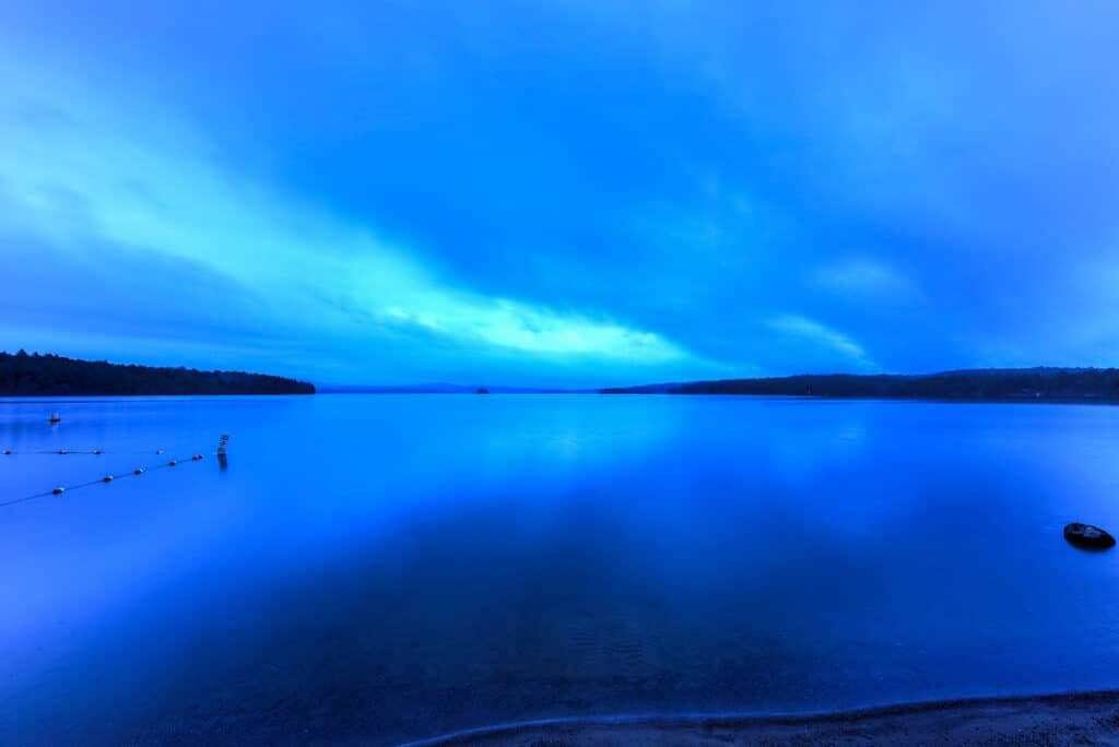 Dusk at Cranberry Lake, one of the largest lakes in the Adirondacks in New York, is an excellent trout fishing lake.