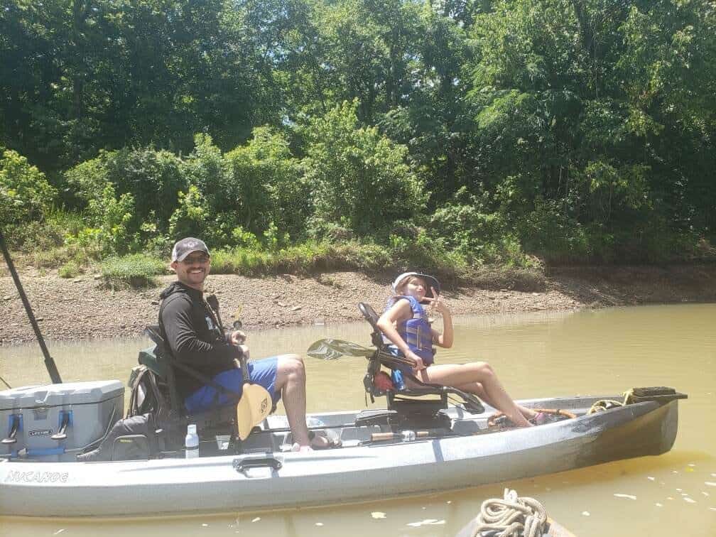 The author and his daughter on a fishing kayak in the Lower Illinois River.