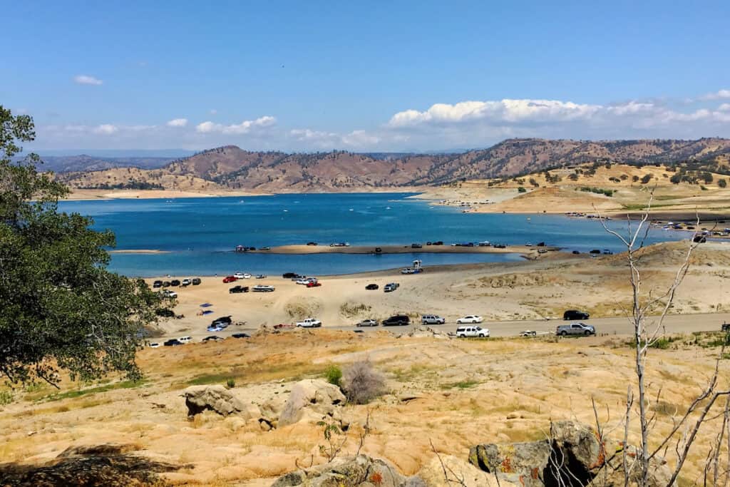 Cars line the edge of Millerton Lake, a popular fishing and boating lake near Fresno and Madera.
