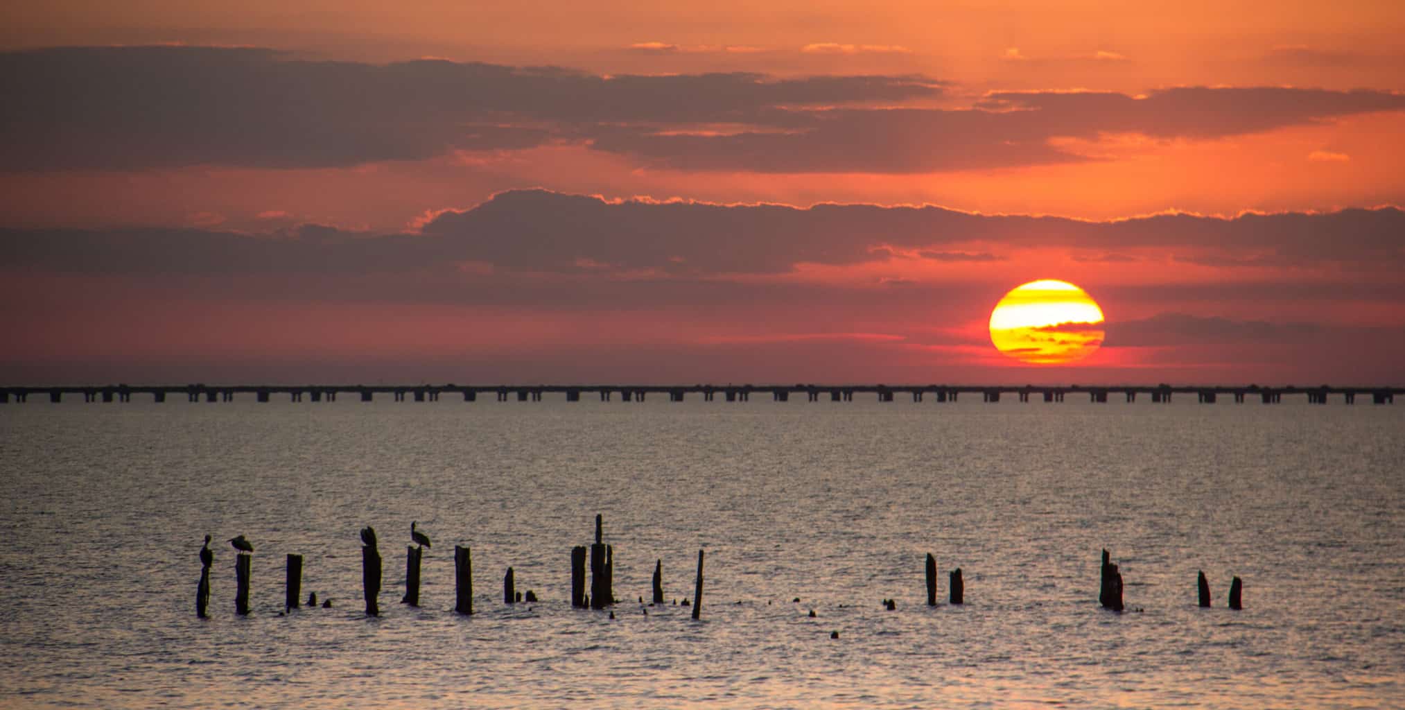Sunset over Lake Pontchartrain with the causeway in the distance.