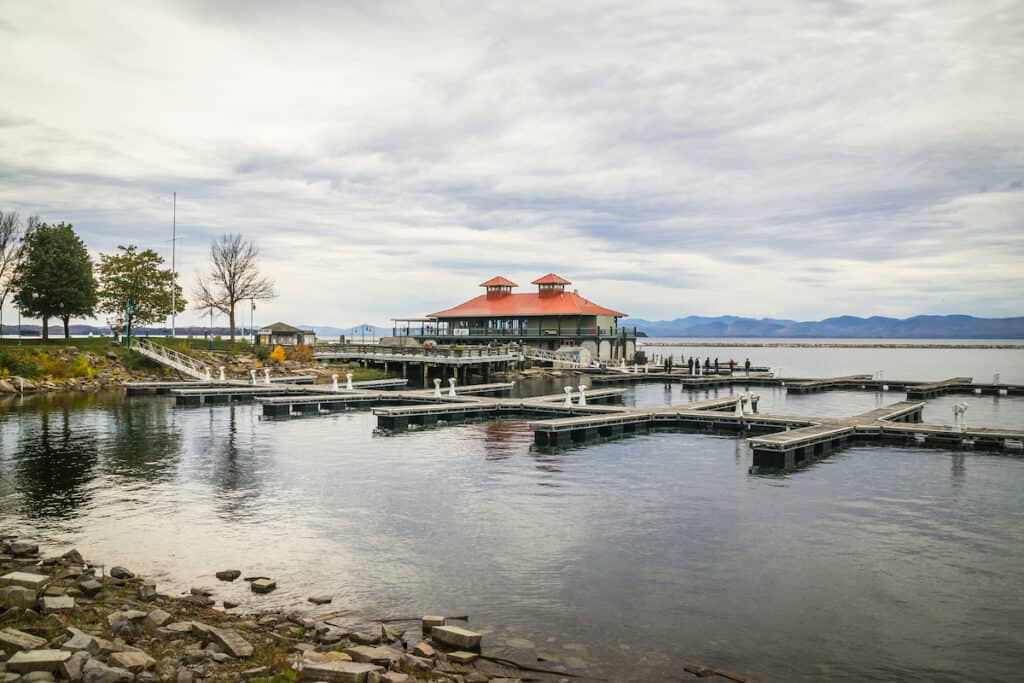 View of a fishing boat marina in Burlington, Vermont. along the quiet shoreline of Lake Champlain.