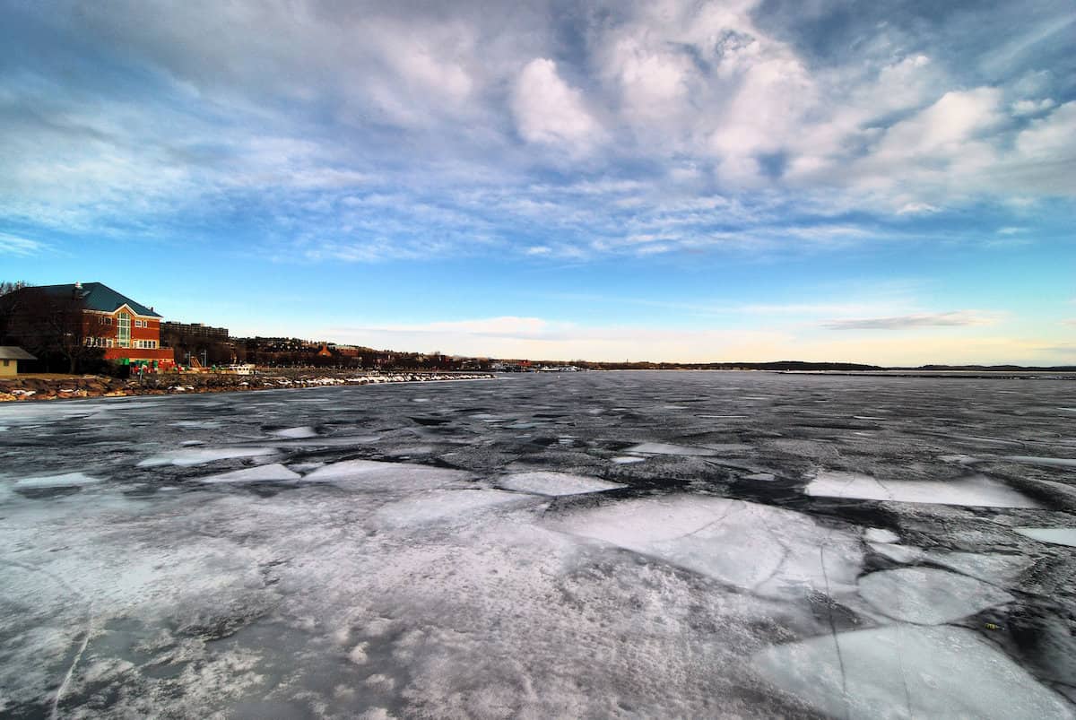 The frozen surface of Lake Champlain near Burlington, one of the best ice fishing lakes in Vermont.
