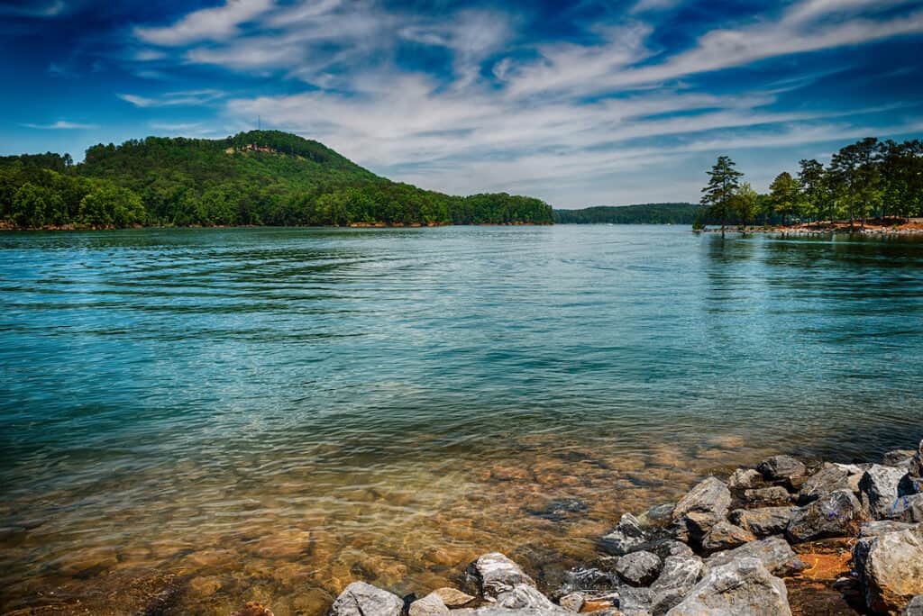 View from shore of the clear waters of Lake Allatoona at Red Top Mountain State Park north of Atlanta.
