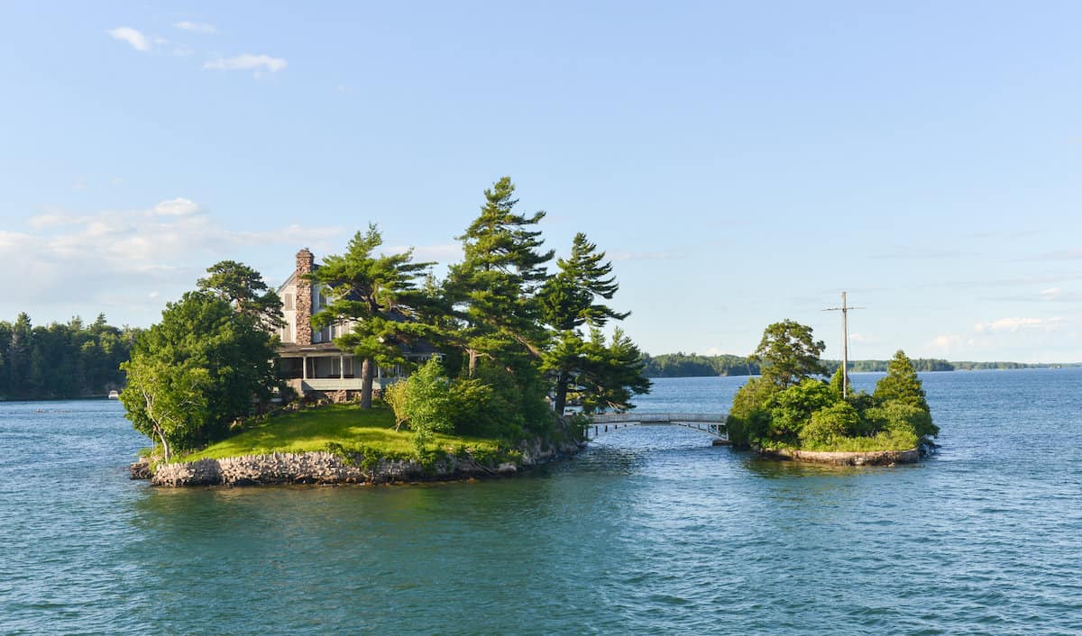 Scenic view of two small islands in the Thousand Island Region on the St. Lawrence River in New York.
