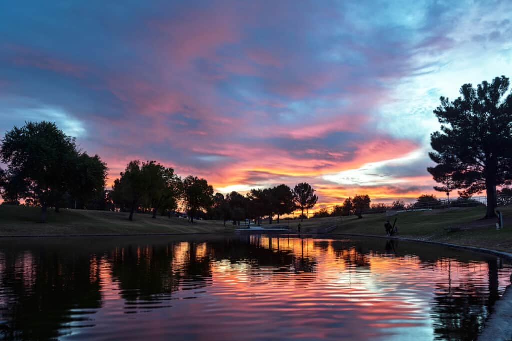 Sunrise over the pond in Greenfield Park in Mesa, Arizona near Phoenix