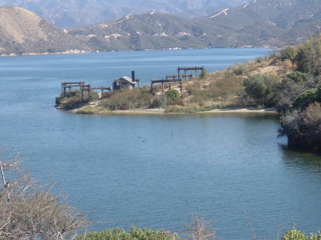 Part of Silverwood Lake State Recreation Area on a peninsula surrounded by the reservoir's blue water.