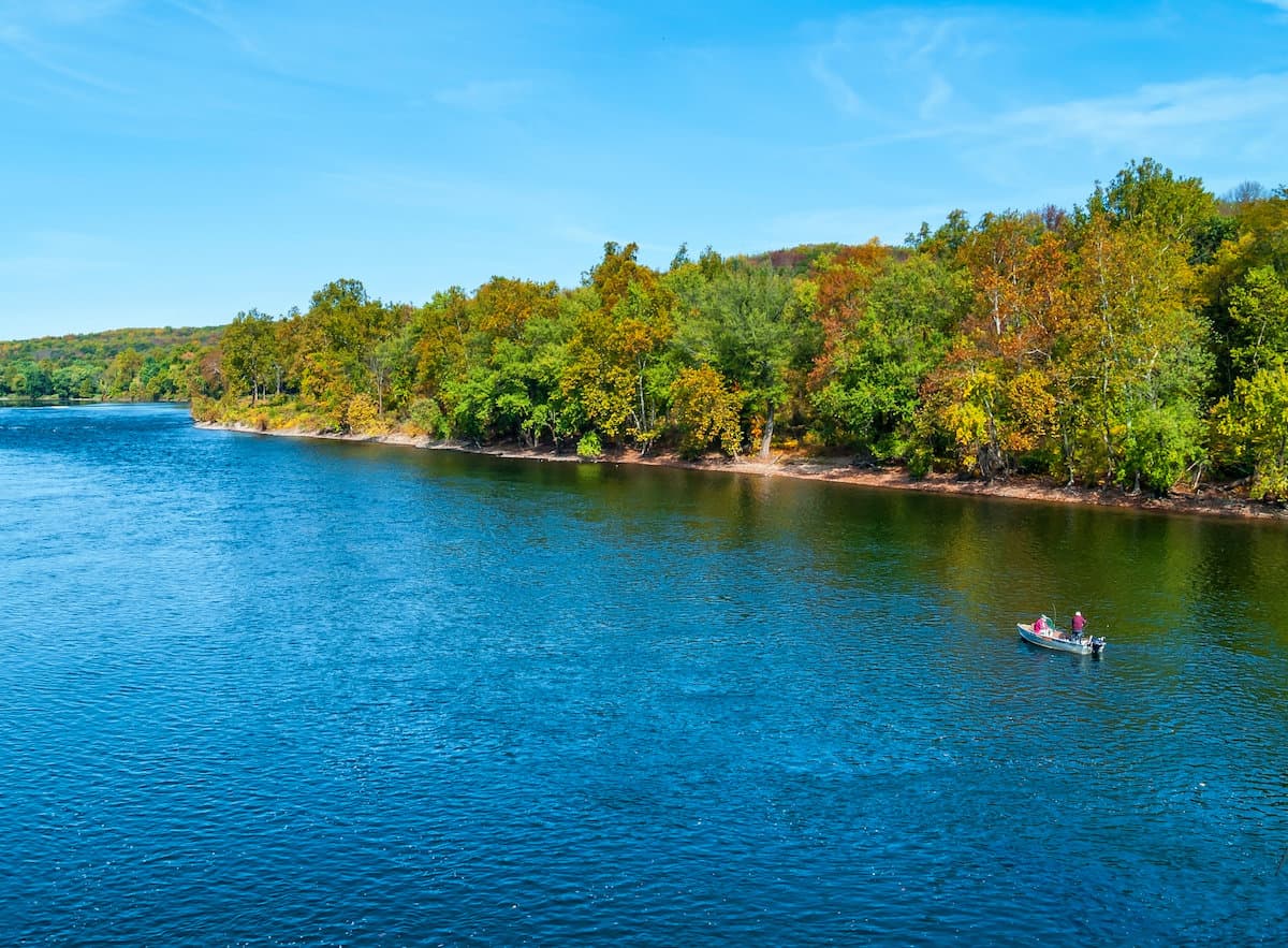 A fishing boat on the blue waters of the Delaware River in Pennsylvania.