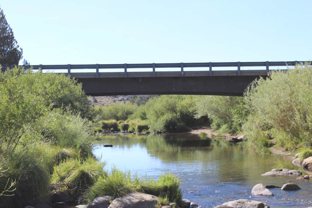 The South Fork Bridge spanning the gently flowing South Fork of the Kern River, the most popular and accessible area to fish at Kennedy Meadows.