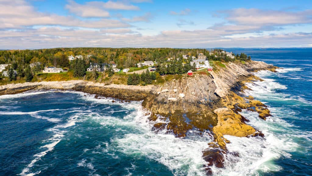 Aerial view of Pemaquid Point Light, a historic lighthouse located in Bristol, Maine. There is excellent striper fishing near the lighthouse as fish round the point.