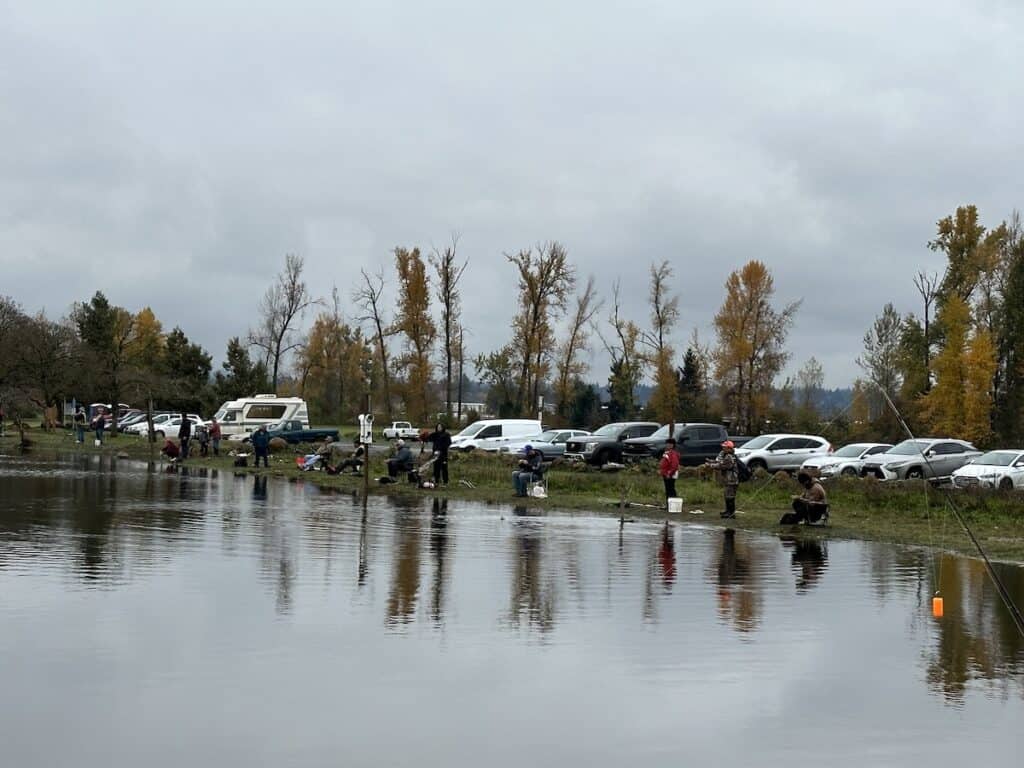 Anglers line the shores of Walter Wirth Lake while fishing for freshly stocked trout.