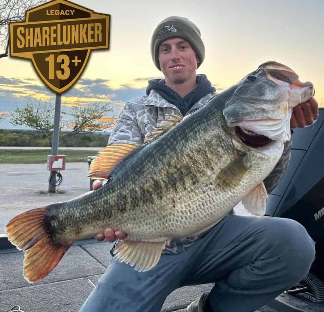 Kyle Hall holds up a nearly 16-pound largemouth bass caught in Texas in March 2024.